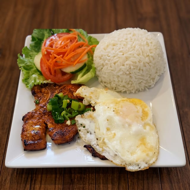C6. Grilled Pork Chop & Fried Egg w/ Rice (Com Suon Trung).